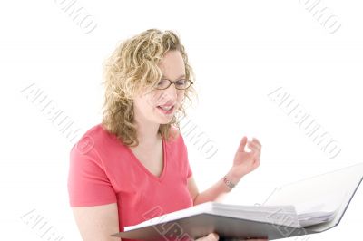 Attractive blonde with glasses checking a folder