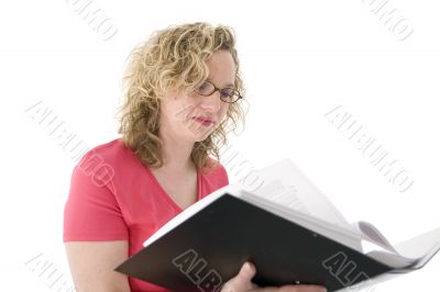 Attractive blonde with glasses checking a folder