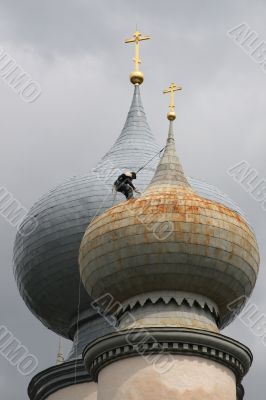 The spider-man on a dome of church