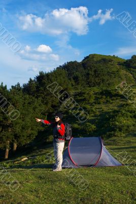 Girl indicating to the horizon