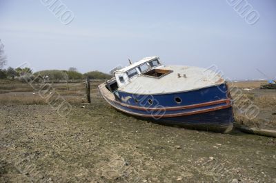 Small boat in the mud