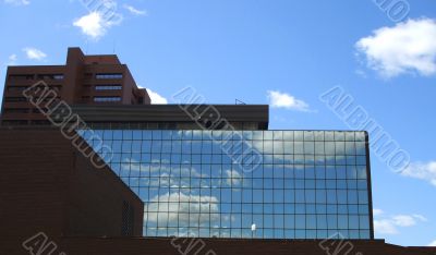 Office Building With Mirrors and Clouds