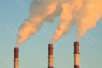 Three smoking chimneys