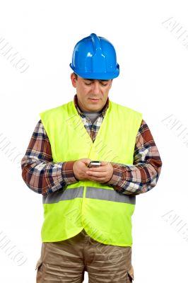 Construction worker sending sms