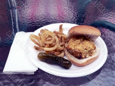 crabcake sandwich with fries and pickle
