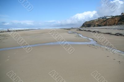Flat beach with homes