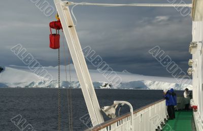 Cruise ship passenger photographing icebergs