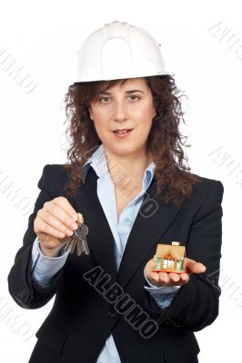 Female architect holding the keys and the house