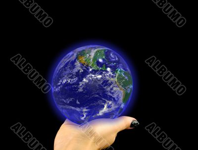 Glowing blue globe on hand