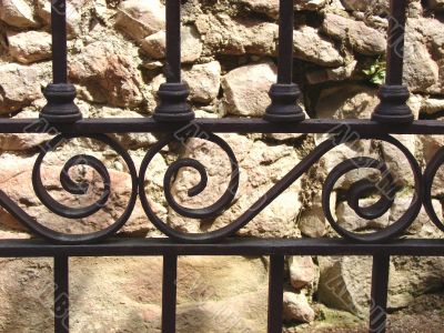 Stone wall and metal lattice