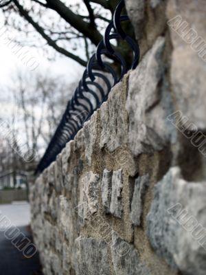 Stone Wall with Wrought Iron Caps