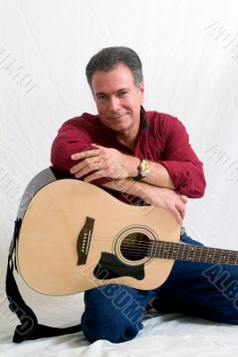 Man in 50`s playing guitar Man in 50`s playing guitar