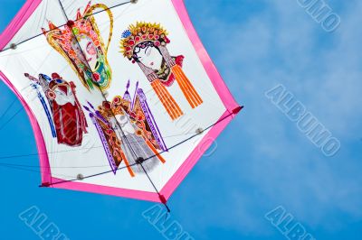 japanese style kite in flight in sunny day
