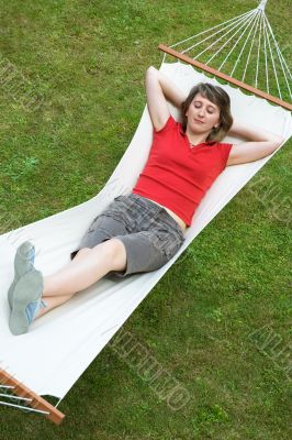 young beautiful girl rest on hammock
