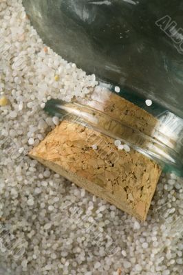 lost glass bottle in beach sand