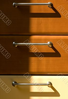 Three steel handles with shadow