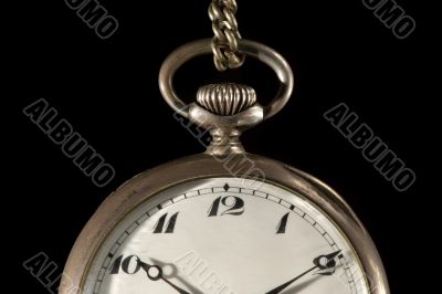 Old pocket watch on black detail