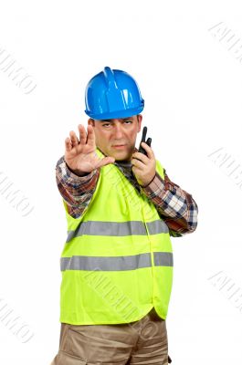 Construction worker talking with a walkie talkie