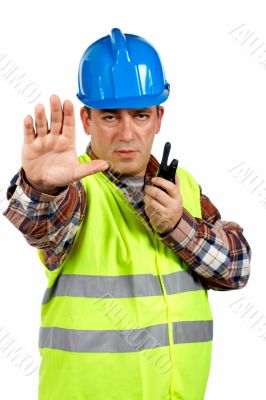 Construction worker talking with a walkie talkie