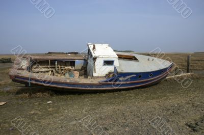 Small boat in the mud