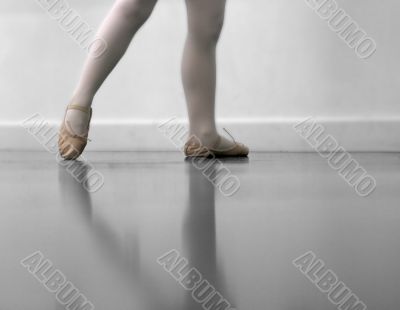 Dancer`s legs and ballet shoes