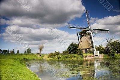 Dutch windmill with dramatic sky