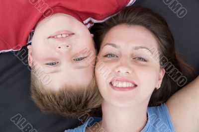 Mum and the son smile.