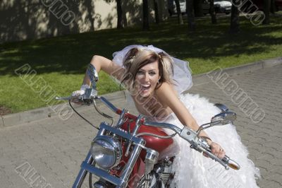 Bride and groom on a motorcycle