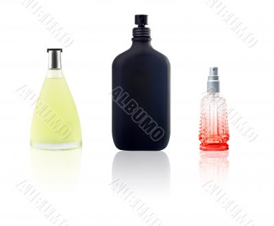 Three bottle of perfum with reflection