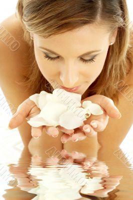 smelling rose petals in water