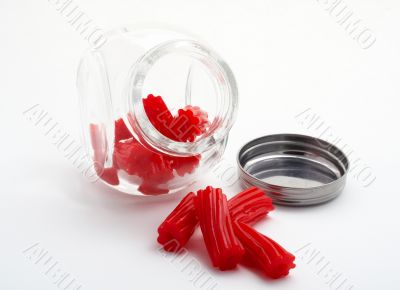 Pieces of red licorice on glass jar