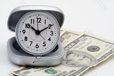 Clock and money (dollars)