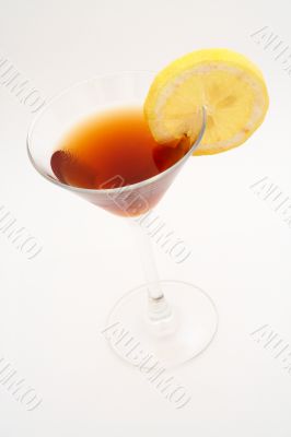 Red cocktail with lemon