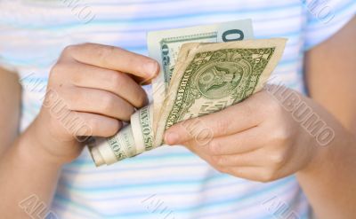 Child counting money (Shallow DOF)
