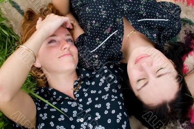 Girls lying on meadow