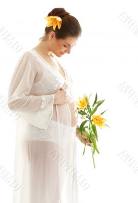 beautiful pregnant woman with yellow lily