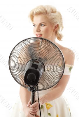 housewife with fan playing pop star