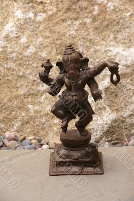 Bronze Ganesha dancing, on granite
