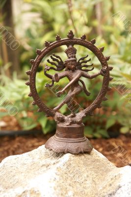 Bronze Shiva in garden