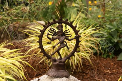 Bronze Shiva in garden