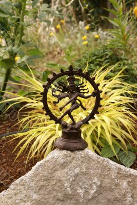 Bronze Shiva in garden