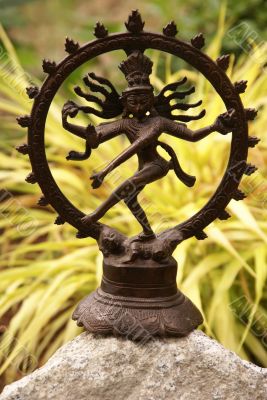 Bronze Shiva in garden