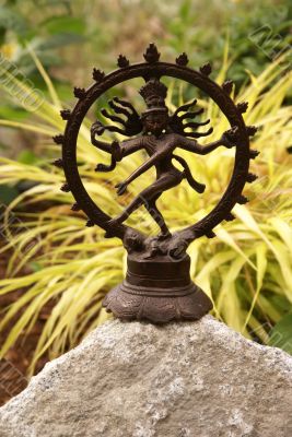Bronze Shiva in garden