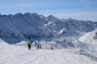 Skiers on high traverse