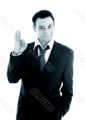 monochrome picture of friendly businessman showing ok sign monochrome picture of friendly businessman showing ok sign