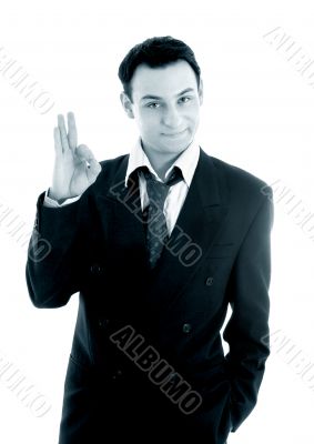 monochrome picture of friendly businessman showing ok sign