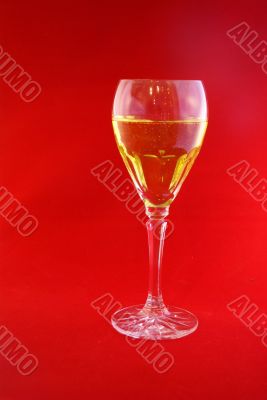 Crystal wine goblet with white wine