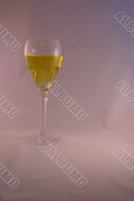 Crystal wine goblet with white wine