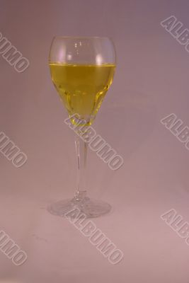 Crystal wine goblet with white wine