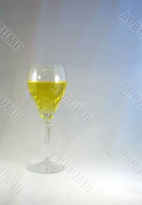 Crystal wine goblet with white wine